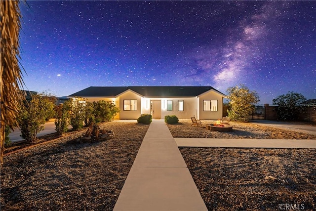 62290 Crestview Dr, Joshua Tree, CA 92252 - view of front of property featuring a fire pit and stucco siding