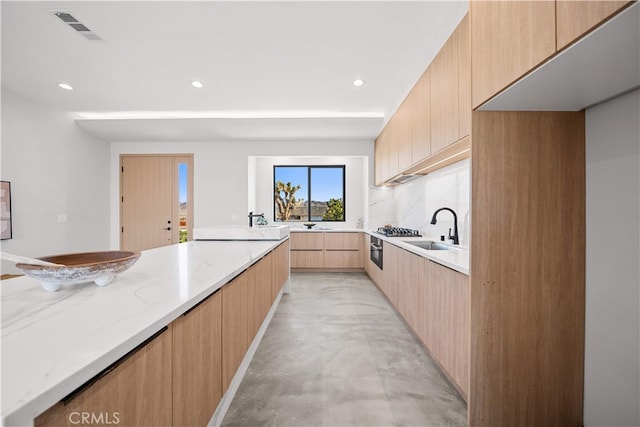 62290 Crestview Dr, Joshua Tree, CA 92252 - kitchen featuring modern cabinets, light brown cabinets, light stone counters, recessed lighting, and finished concrete floors