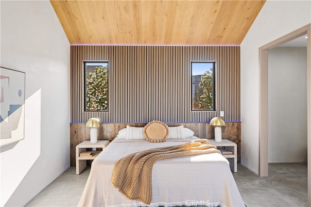 62290 Crestview Dr, Joshua Tree, CA 92252 - bedroom featuring wooden ceiling, vaulted ceiling, wood walls, and finished concrete flooring