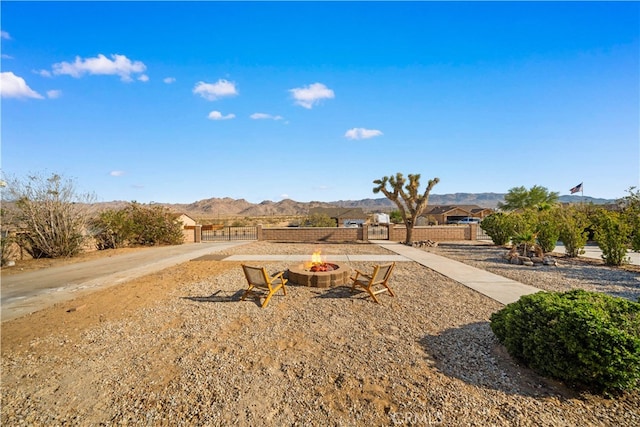 62290 Crestview Dr, Joshua Tree, CA 92252 - view of yard featuring a fire pit and a mountain view