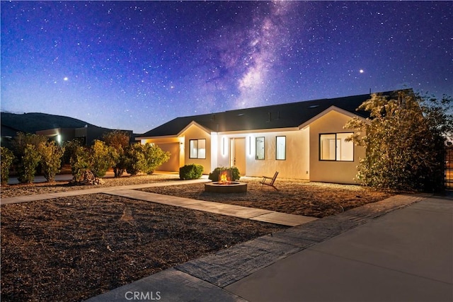 62290 Crestview Dr, Joshua Tree, CA 92252 - view of front facade featuring a fire pit and stucco siding