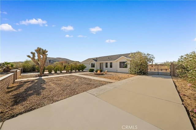 62290 Crestview Dr, Joshua Tree, CA 92252 - ranch-style home featuring a gate and stucco siding