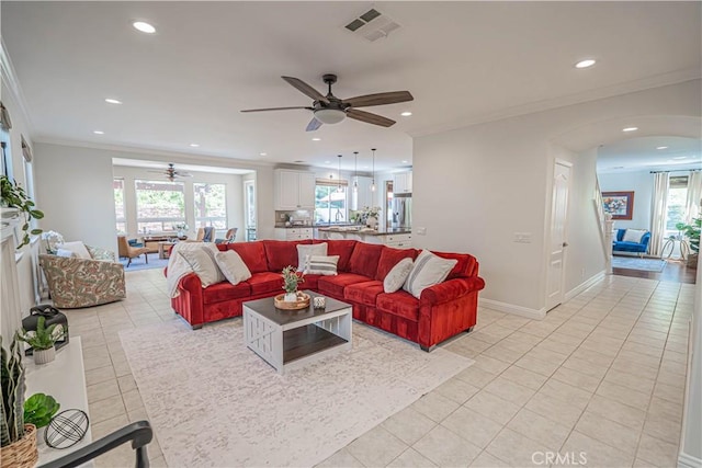 26511 Brooks Cir, Stevenson Ranch, CA 91381 - living area featuring ceiling fan, light tile patterned flooring, recessed lighting, arched walkways, and ornamental molding