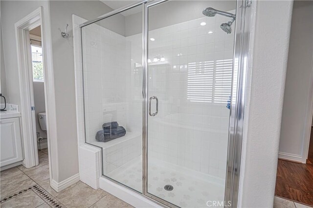 26511 Brooks Cir, Stevenson Ranch, CA 91381 - full bathroom featuring a stall shower and tile patterned flooring