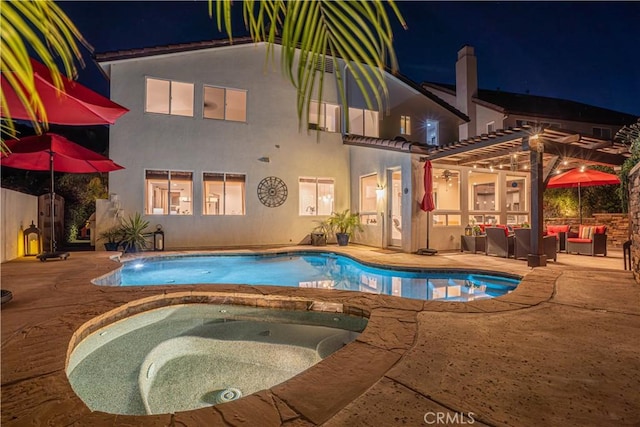 26511 Brooks Cir, Stevenson Ranch, CA 91381 - pool at night with an outdoor pool, an outdoor living space, and an in-ground hot tub