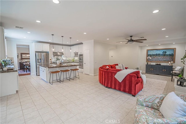 26511 Brooks Cir, Stevenson Ranch, CA 91381 - living area featuring recessed lighting, a ceiling fan, light tile patterned floors, and ornamental molding