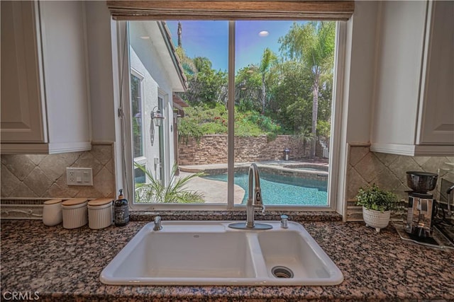 26511 Brooks Cir, Stevenson Ranch, CA 91381 - kitchen featuring decorative backsplash and dark stone countertops