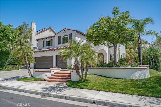 26511 Brooks Cir, Stevenson Ranch, CA 91381 - mediterranean / spanish-style house featuring a garage, stucco siding, a tiled roof, concrete driveway, and a chimney