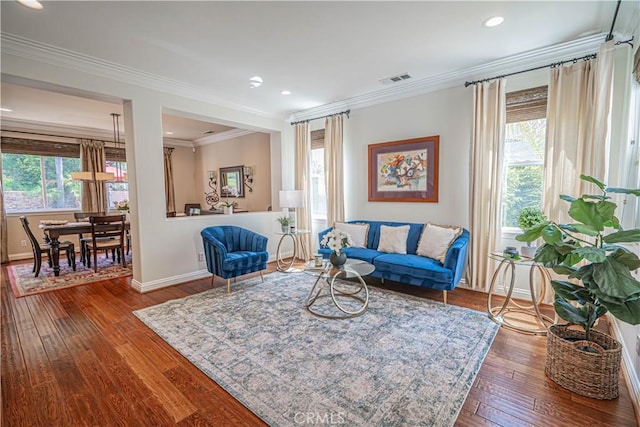 26511 Brooks Cir, Stevenson Ranch, CA 91381 - living room featuring dark wood-type flooring, crown molding, and recessed lighting