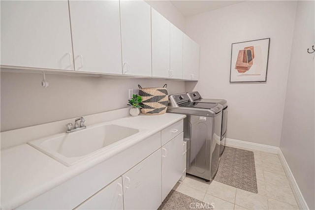26511 Brooks Cir, Stevenson Ranch, CA 91381 - laundry room with washer and clothes dryer, cabinet space, and light tile patterned floors