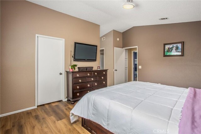 26490 Mapleridge Way, Moreno Valley, CA 92555 - bedroom featuring wood finished floors and lofted ceiling