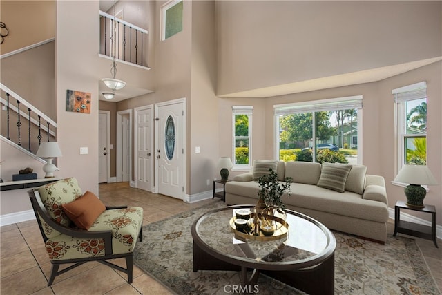 26490 Mapleridge Way, Moreno Valley, CA 92555 - tiled living area featuring stairway and a towering ceiling