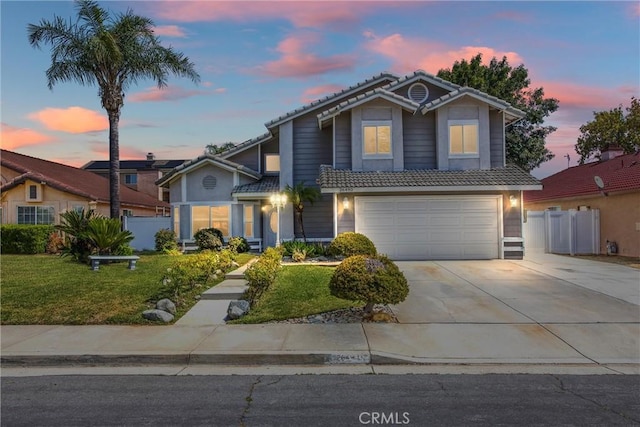 26490 Mapleridge Way, Moreno Valley, CA 92555 - traditional-style house with a tiled roof, an attached garage, driveway, and stucco siding