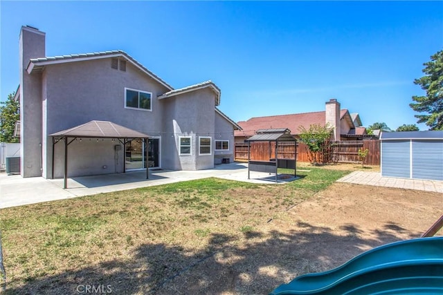26490 Mapleridge Way, Moreno Valley, CA 92555 - back of house featuring a patio area, stucco siding, a chimney, a playground, and a gazebo