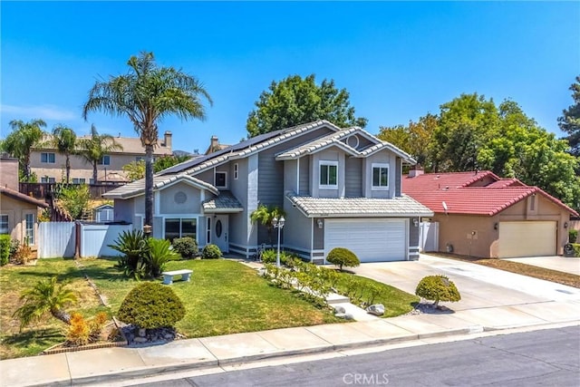 26490 Mapleridge Way, Moreno Valley, CA 92555 - traditional home with driveway, roof mounted solar panels, a tile roof, stucco siding, and a garage