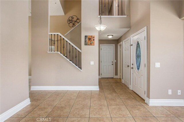 26490 Mapleridge Way, Moreno Valley, CA 92555 - tiled foyer with baseboards and stairs