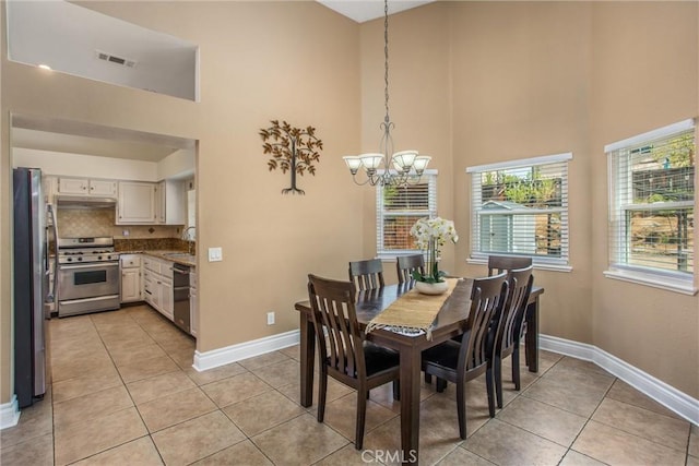 26490 Mapleridge Way, Moreno Valley, CA 92555 - dining room featuring a high ceiling, a chandelier, and light tile patterned floors