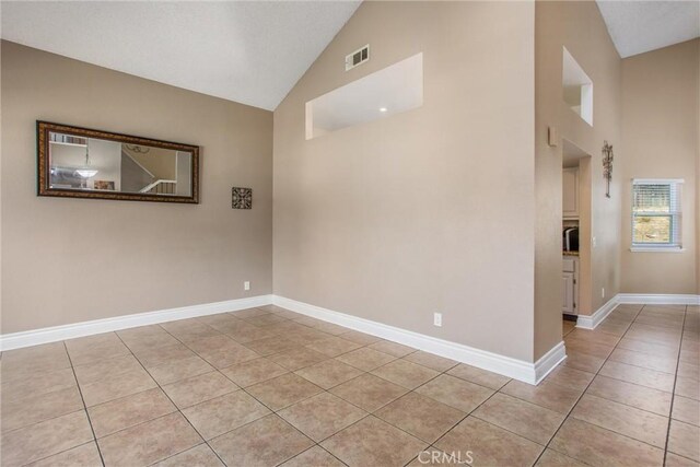 26490 Mapleridge Way, Moreno Valley, CA 92555 - empty room with light tile patterned flooring and high vaulted ceiling