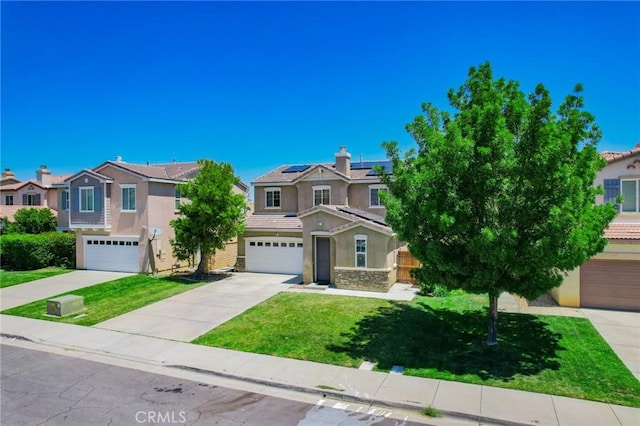 2753 Hornbeam Rd, Palmdale, CA 93551 - view of front of home with stucco siding, solar panels, a front lawn, a residential view, and concrete driveway