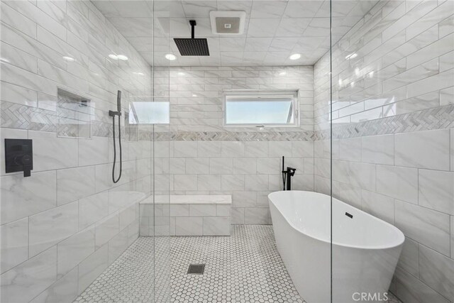 11533 Poppyglen Ct, Moorpark, CA 93021 - full bathroom featuring a freestanding tub, a tile shower, tile walls, and tile patterned floors