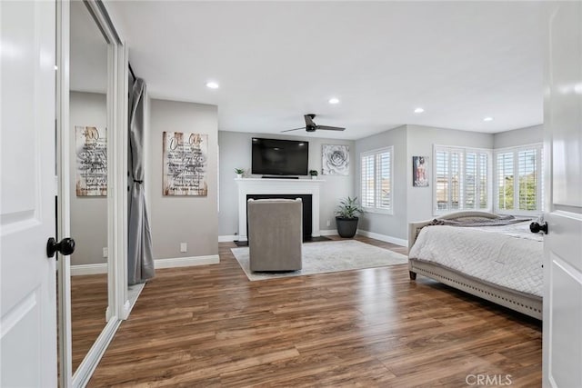 11533 Poppyglen Ct, Moorpark, CA 93021 - bedroom with a fireplace with flush hearth, wood finished floors, and recessed lighting