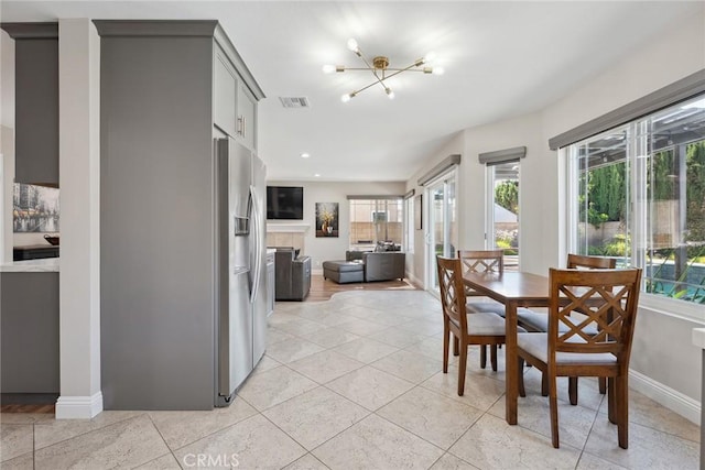 11533 Poppyglen Ct, Moorpark, CA 93021 - dining space featuring healthy amount of natural light, a chandelier, light tile patterned floors, and recessed lighting