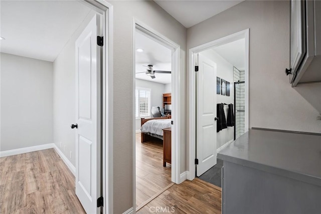11533 Poppyglen Ct, Moorpark, CA 93021 - hallway with light wood finished floors and baseboards