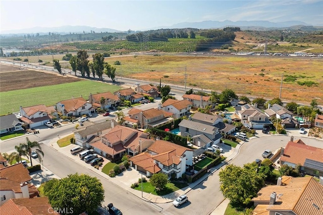 11533 Poppyglen Ct, Moorpark, CA 93021 - overview of rural landscape with a mountain backdrop and nearby suburban area
