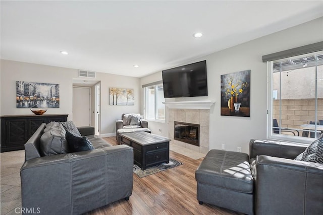 11533 Poppyglen Ct, Moorpark, CA 93021 - living room featuring a fireplace, recessed lighting, and wood finished floors