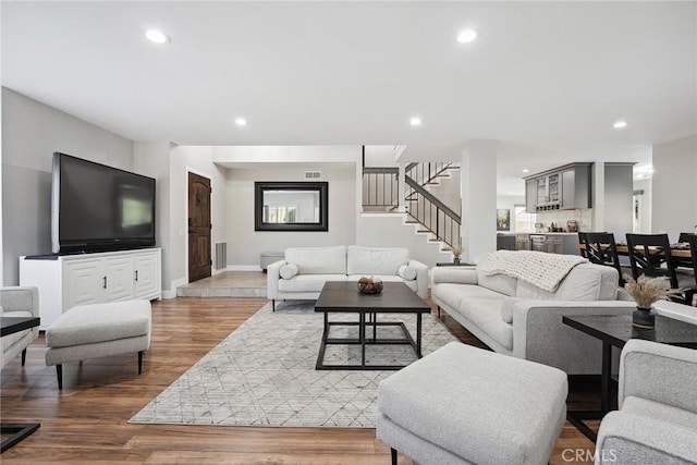 11533 Poppyglen Ct, Moorpark, CA 93021 - living room featuring stairway, wood finished floors, and recessed lighting