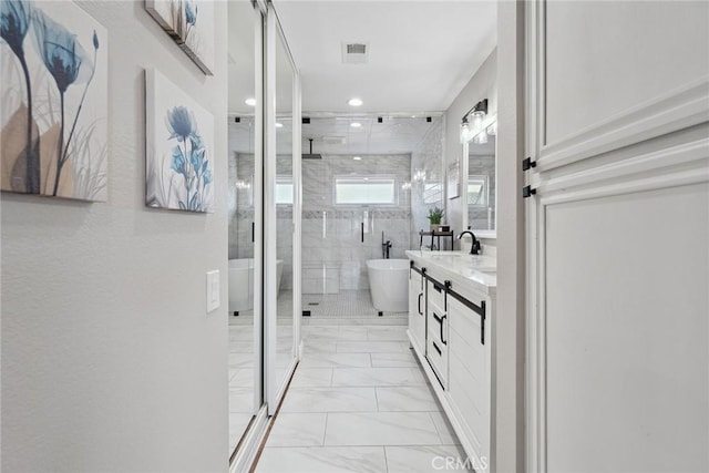 11533 Poppyglen Ct, Moorpark, CA 93021 - bathroom with marble look tile flooring, a stall shower, double vanity, a freestanding bath, and recessed lighting