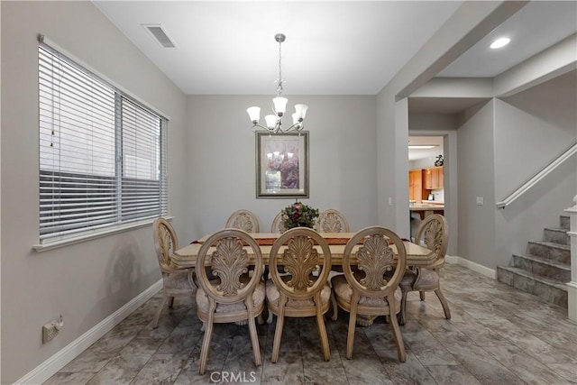 2175 Lester Ave, Clovis, CA 93619 - dining area with a chandelier and stairs