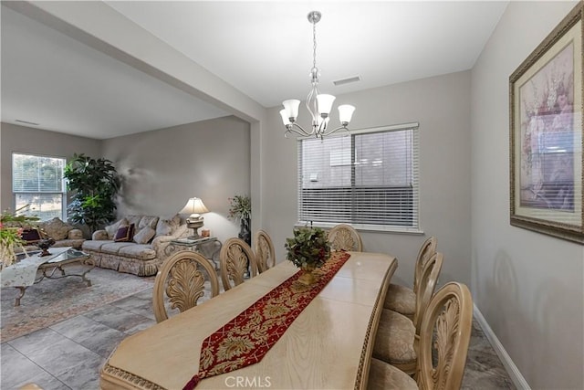 2175 Lester Ave, Clovis, CA 93619 - dining room with a chandelier and baseboards