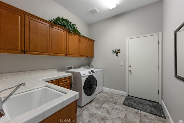 2175 Lester Ave, Clovis, CA 93619 - washroom featuring cabinet space and washer and dryer