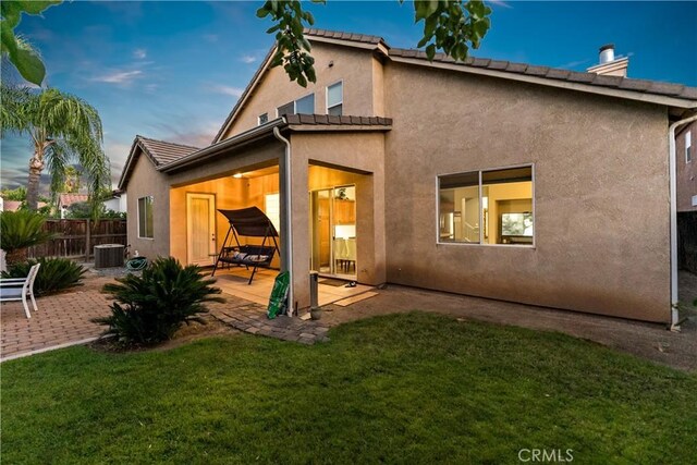 2175 Lester Ave, Clovis, CA 93619 - rear view of property featuring a patio area, a chimney, and stucco siding