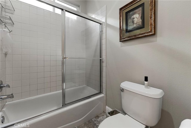 2175 Lester Ave, Clovis, CA 93619 - full bathroom featuring toilet and shower / bath combination with glass door