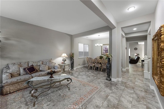 2175 Lester Ave, Clovis, CA 93619 - living area featuring a chandelier and baseboards