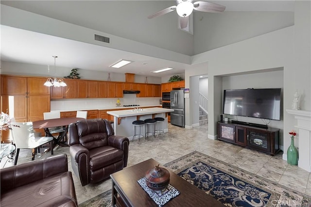 2175 Lester Ave, Clovis, CA 93619 - living room featuring ceiling fan, a chandelier, and high vaulted ceiling