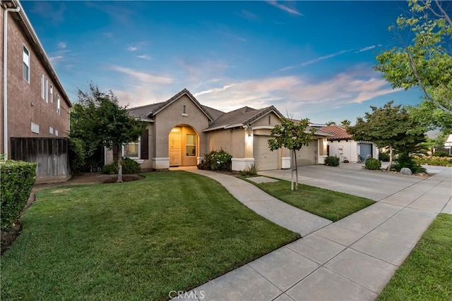 2175 Lester Ave, Clovis, CA 93619 - view of front of property featuring concrete driveway, stucco siding, a garage, and a tiled roof