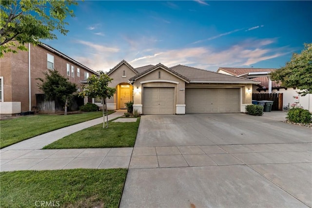 2175 Lester Ave, Clovis, CA 93619 - view of front facade with a garage, stucco siding, driveway, and a tile roof
