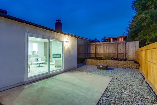 6548 Bantam Lake Cir, San Diego, CA 92119 - yard at night featuring a patio and a fenced backyard