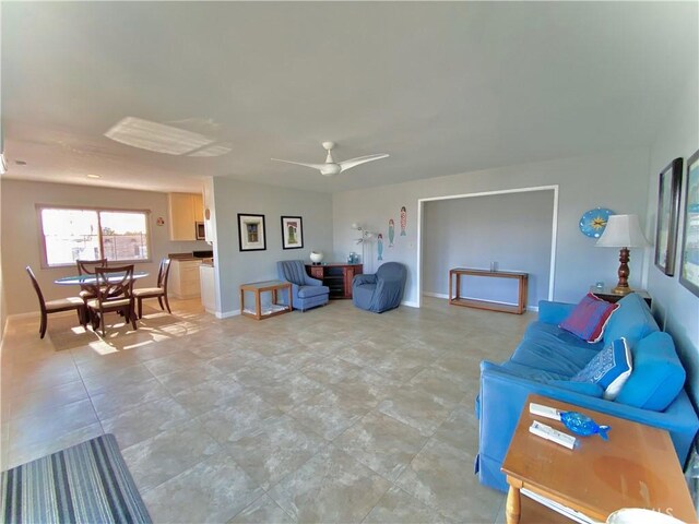 3707 E Livingston Dr Unit 403, Long Beach, CA 90803 - sitting room with ceiling fan and baseboards