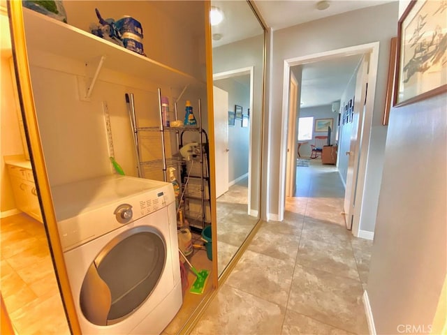 3707 E Livingston Dr Unit 403, Long Beach, CA 90803 - laundry area with washer / clothes dryer and light tile patterned floors