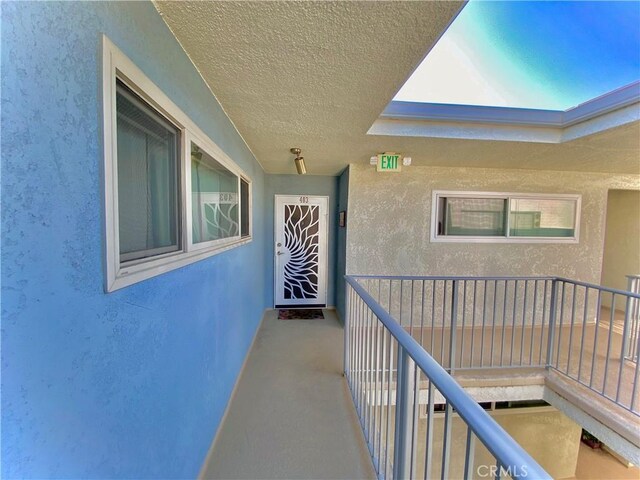3707 E Livingston Dr Unit 403, Long Beach, CA 90803 - entrance to property with stucco siding and a balcony