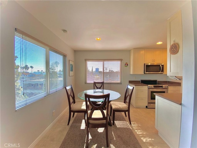3707 E Livingston Dr Unit 403, Long Beach, CA 90803 - dining area featuring recessed lighting and light tile patterned flooring