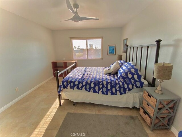 3707 E Livingston Dr Unit 403, Long Beach, CA 90803 - tiled bedroom featuring baseboards and a ceiling fan