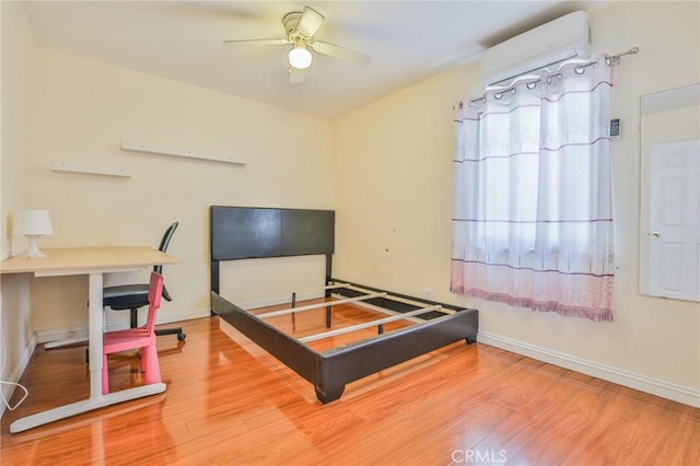 12818 Ramsey Dr, La Mirada, CA 90638 - bedroom featuring wood finished floors and a wall mounted AC