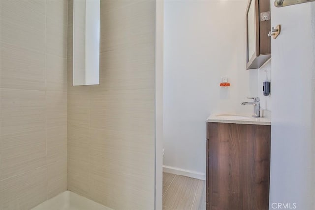 12818 Ramsey Dr, La Mirada, CA 90638 - bathroom featuring vanity and tiled shower