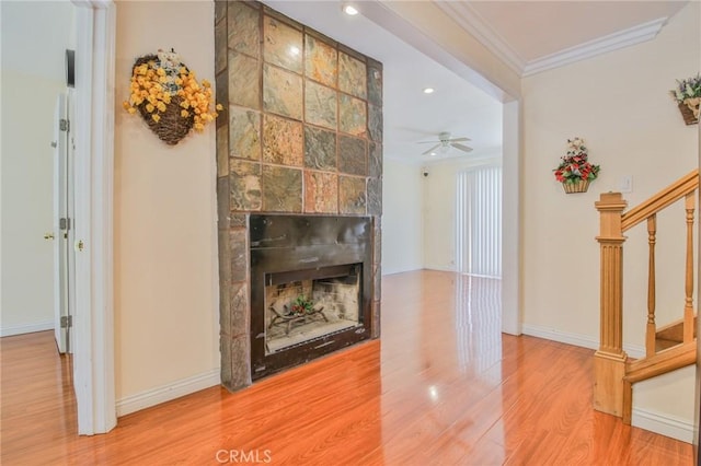 12818 Ramsey Dr, La Mirada, CA 90638 - living area with stairway, wood finished floors, crown molding, a ceiling fan, and recessed lighting