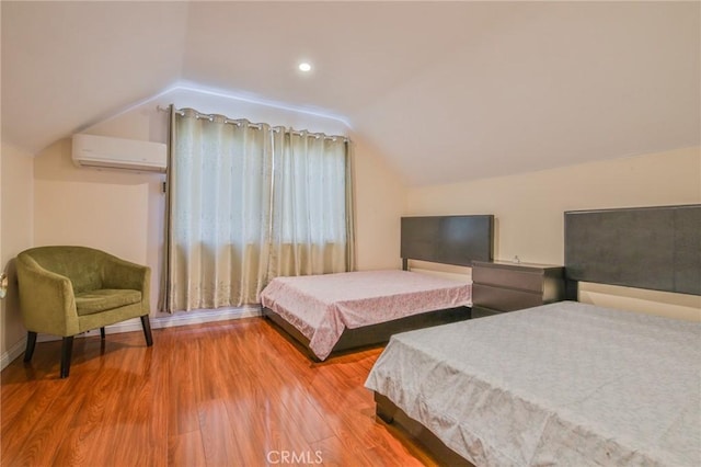 12818 Ramsey Dr, La Mirada, CA 90638 - bedroom featuring a wall mounted AC, lofted ceiling, and wood finished floors